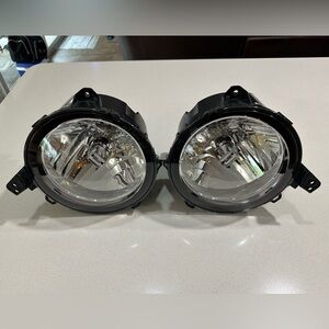 Mopar OEM Headlamps Part No: 55112873AG And 55112872AG Left And Right One.